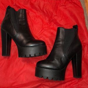 Koi Couture black platform boots
